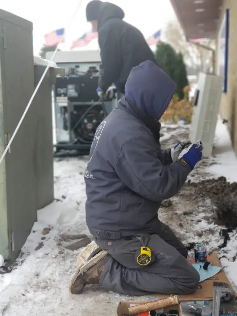 ESCON Power Solutions crew working on a generator installation