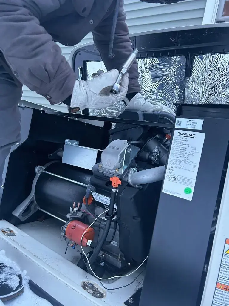 ESCON technician performing generator maintenance